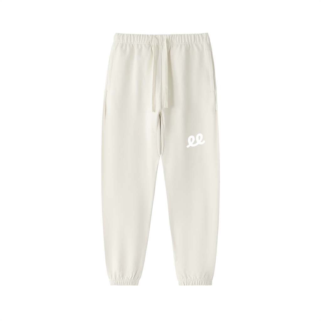 Elastic Signal Sweatpants in Apricot, front: white ee monogram on the left thigh