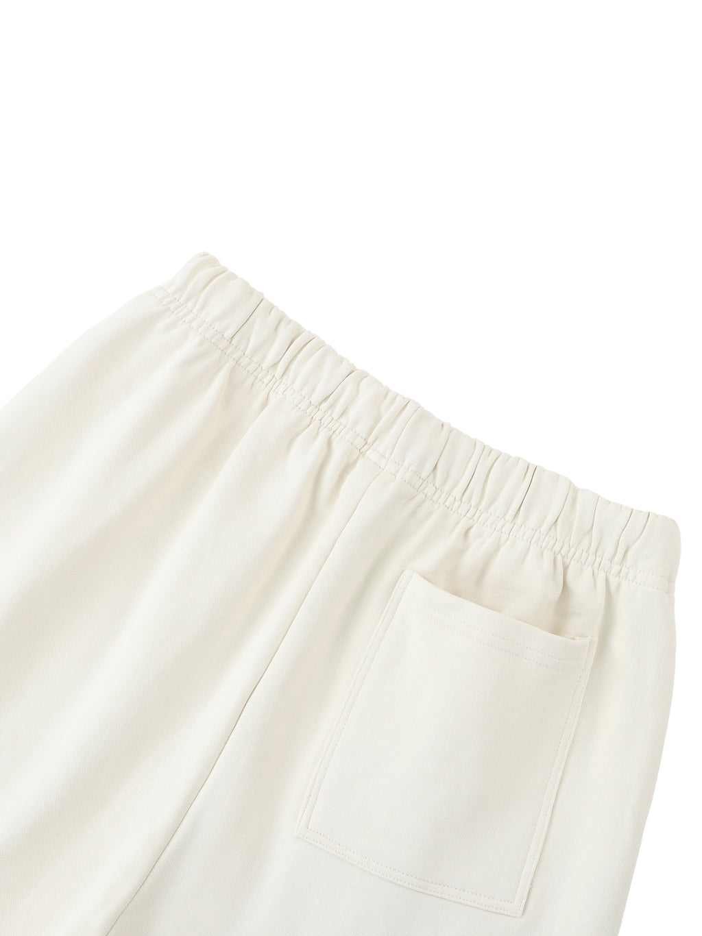 Elastic Signal Sweatpants detail in Apricot: elastic waist and rear patch pocket